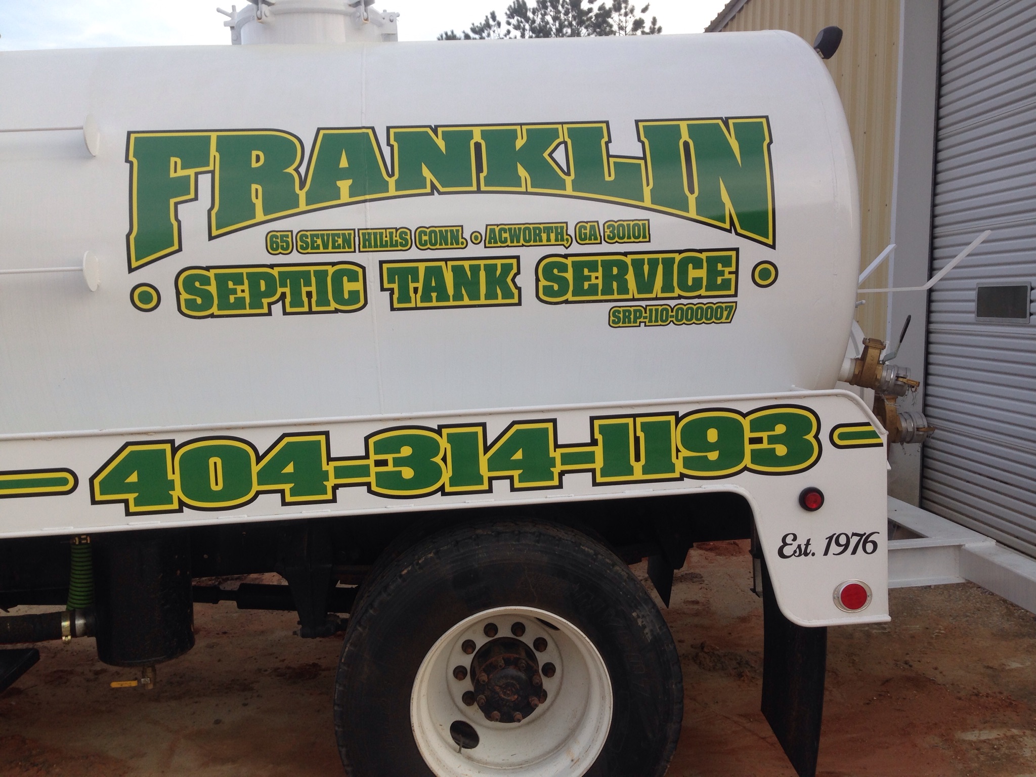 Franklin Septic Tank Service truck — wordmark, phone, and Est. 1976